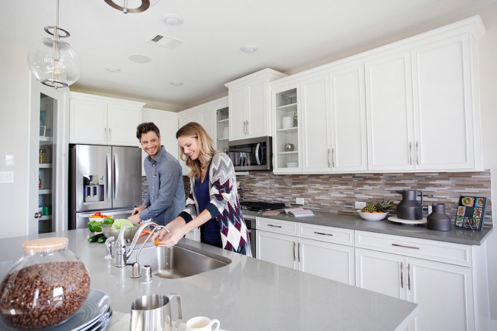 Couple Preparing Food in Updated Kitchen